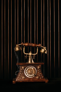black and gold rotary phone
