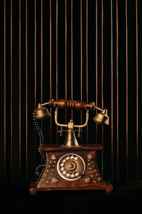 black and gold rotary phone