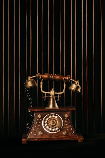 black and gold rotary phone