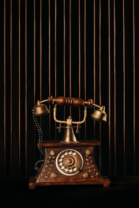 black and gold rotary phone