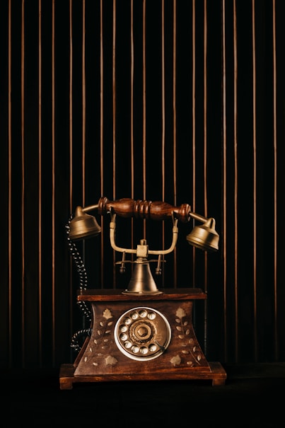 black and gold rotary phone