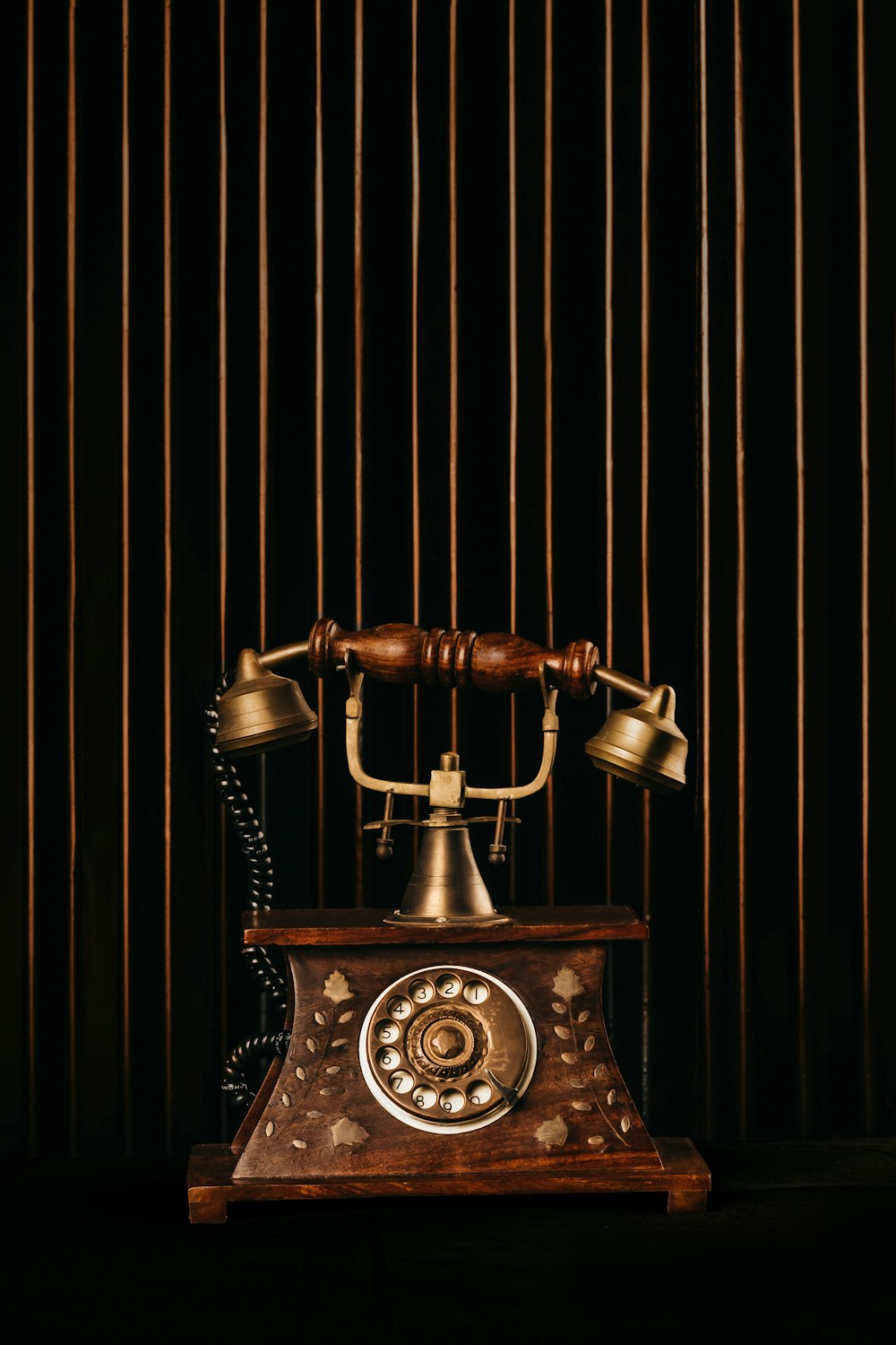 black and gold rotary phone