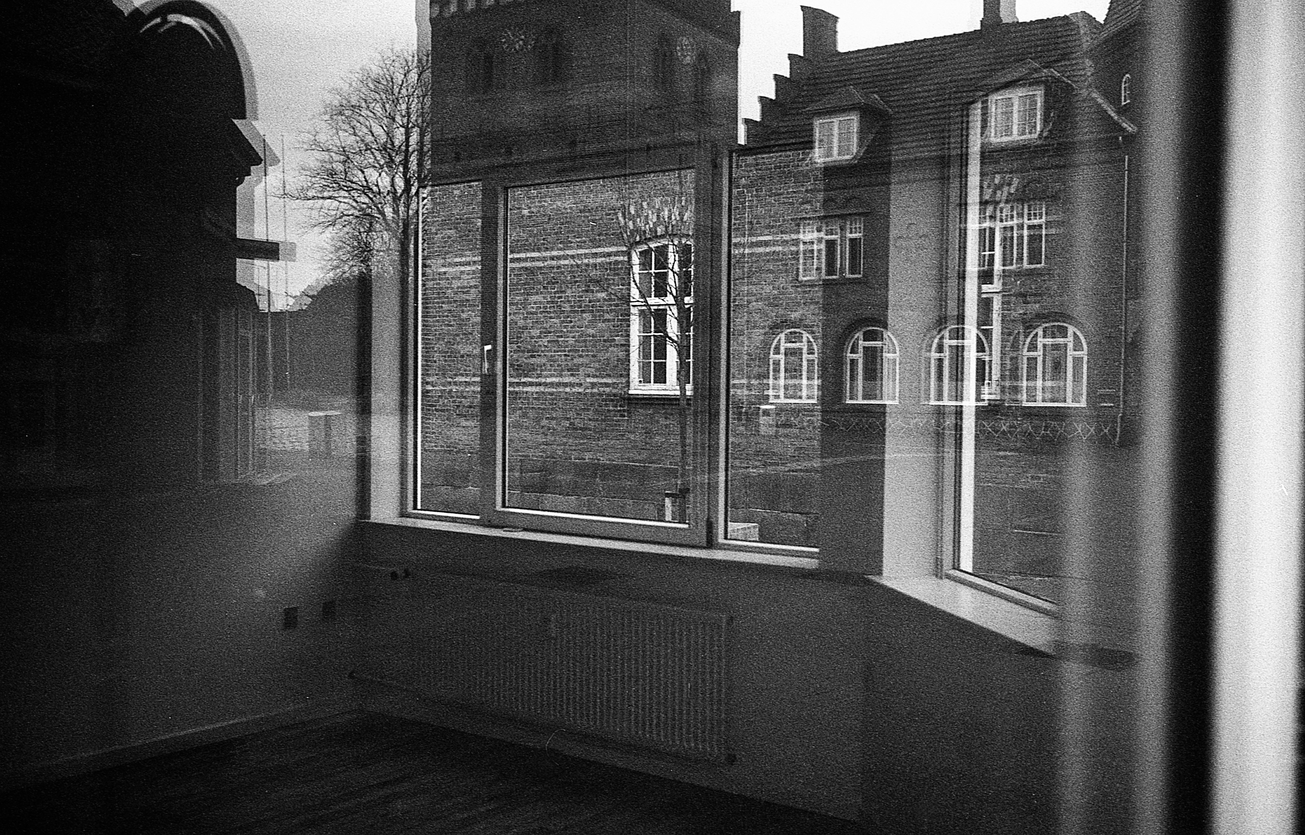 grayscale photo of glass window