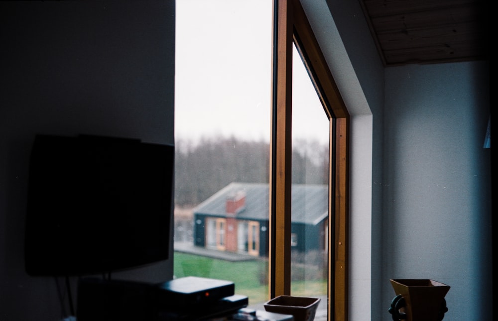 brown wooden framed glass window