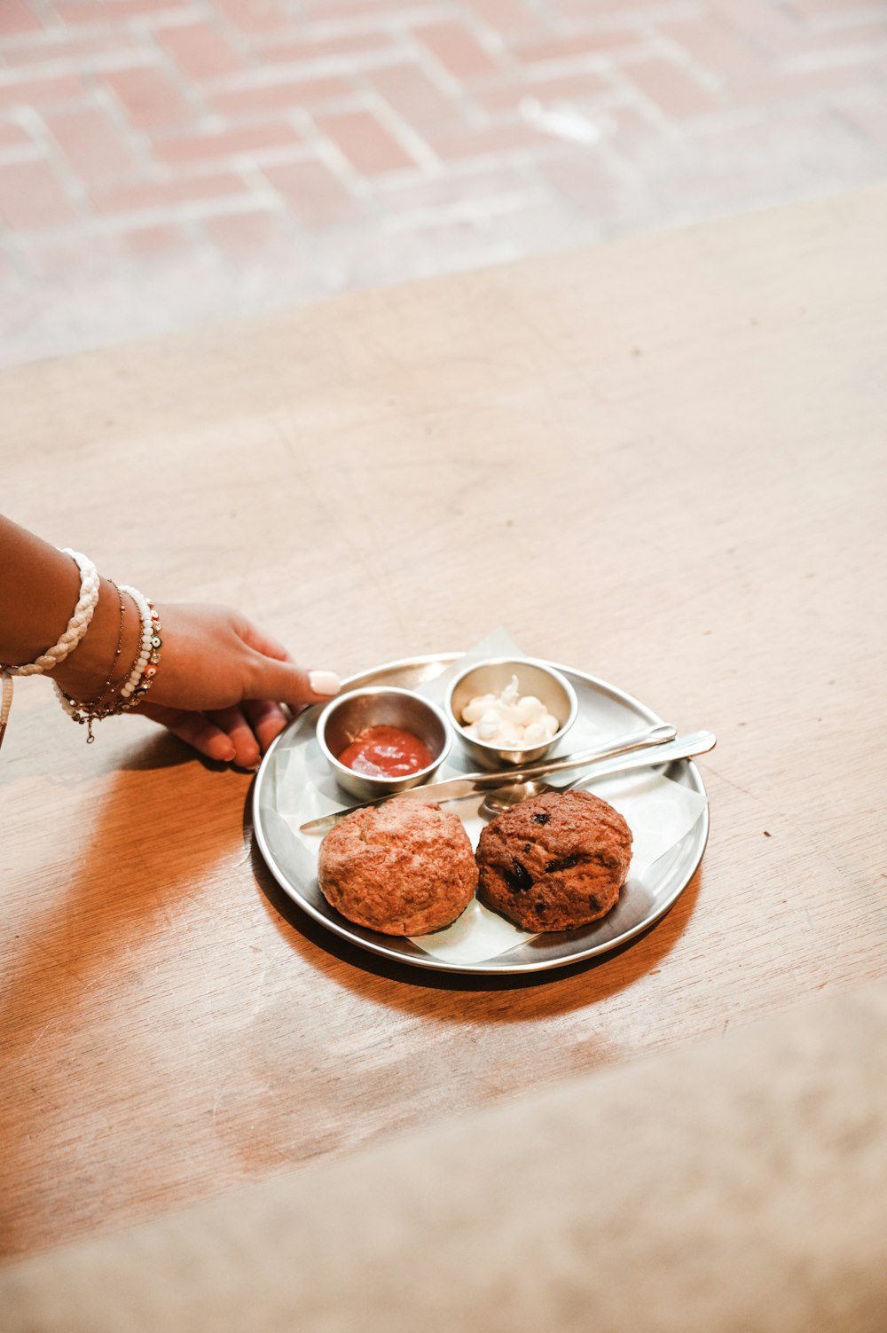 person holding white ceramic bowl with food