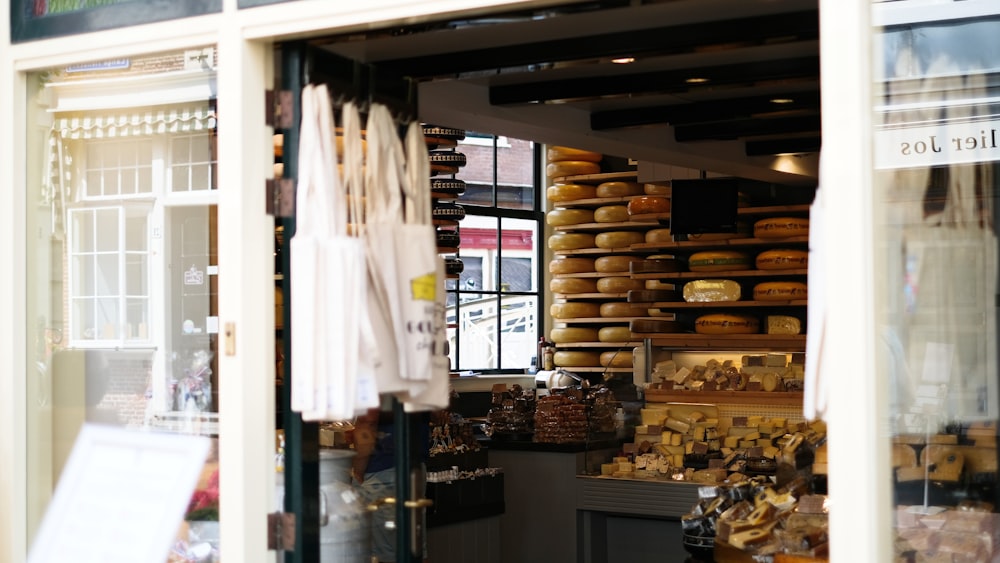 white textile hanged on brown wooden rack