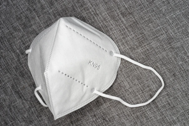 A man tying the Anker sleep mask, showing the simple yet solid design.