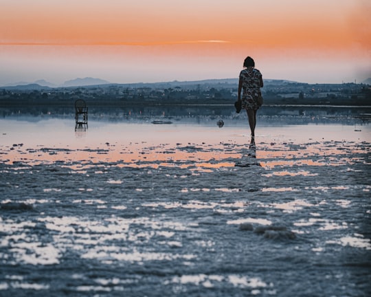 person in black jacket standing on snow covered ground during sunset in Torrevieja Spain
