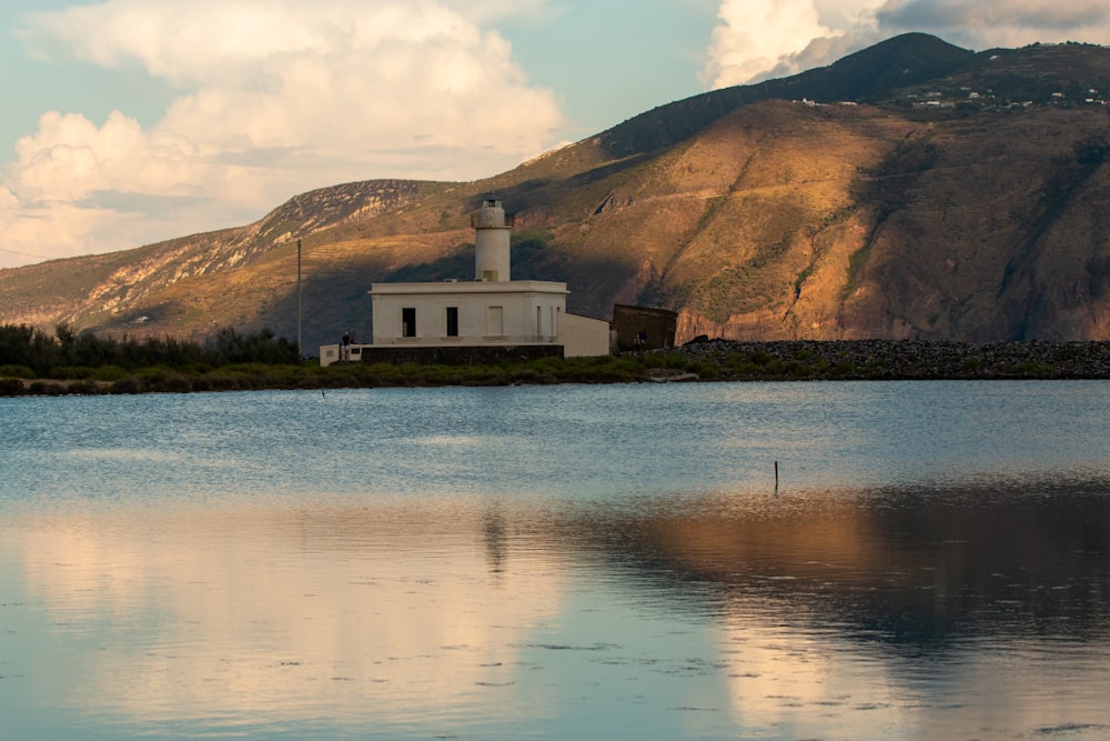 white concrete building near body of water during daytime