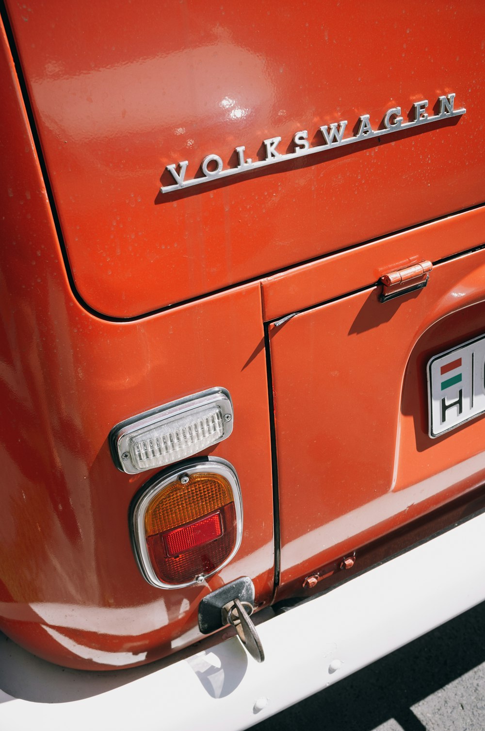 red and silver car license plate