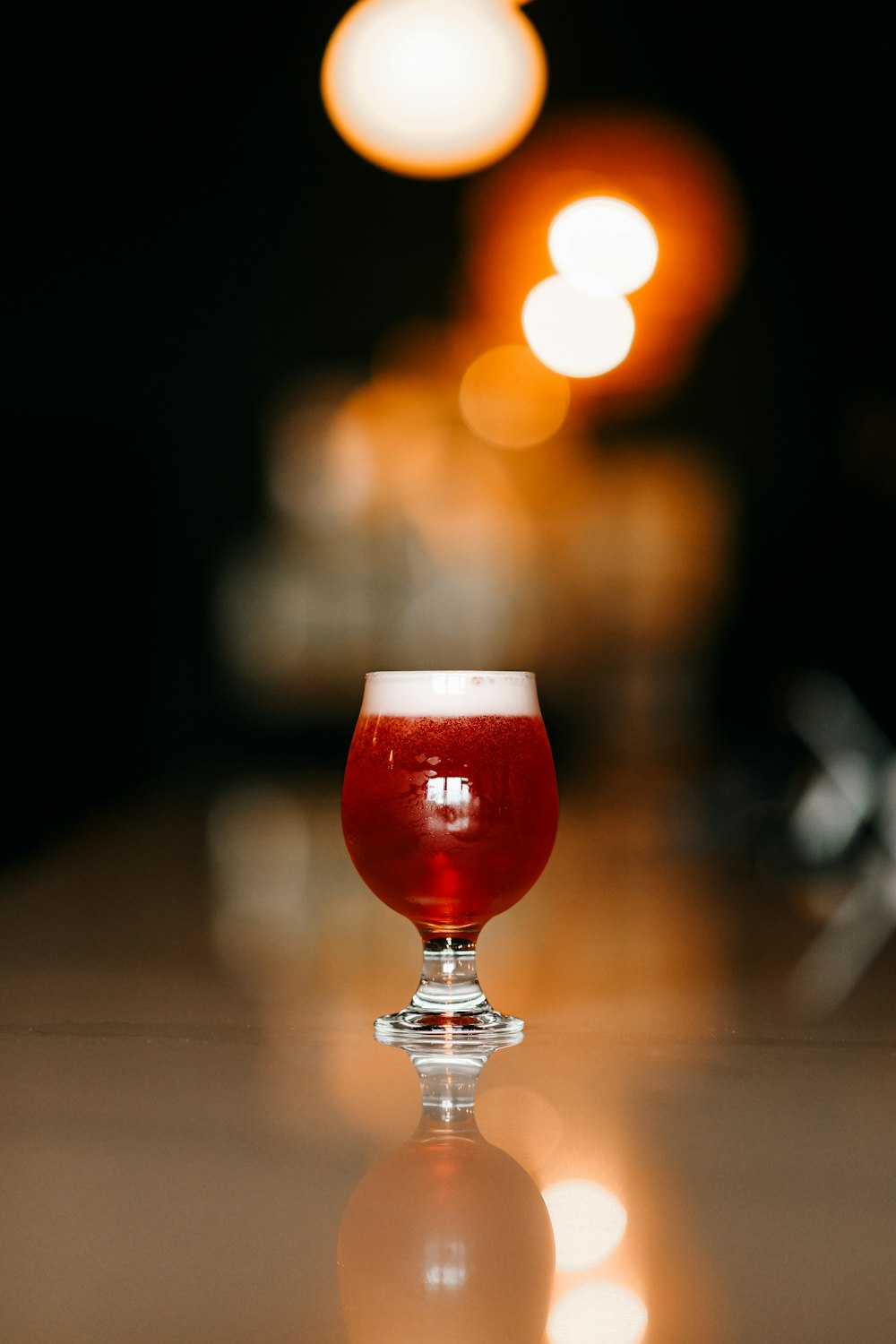 clear wine glass with red liquid