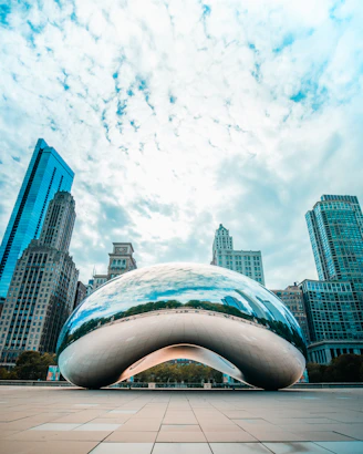 white and blue concrete building under white clouds and blue sky during daytime