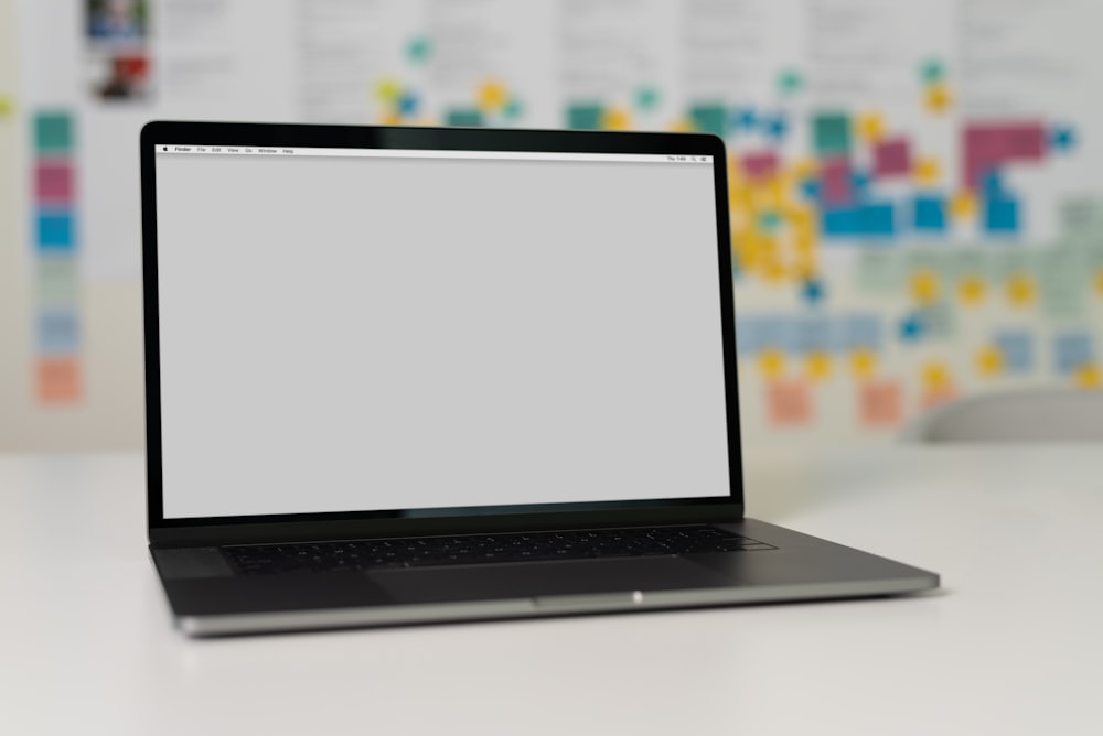 macbook pro on white table