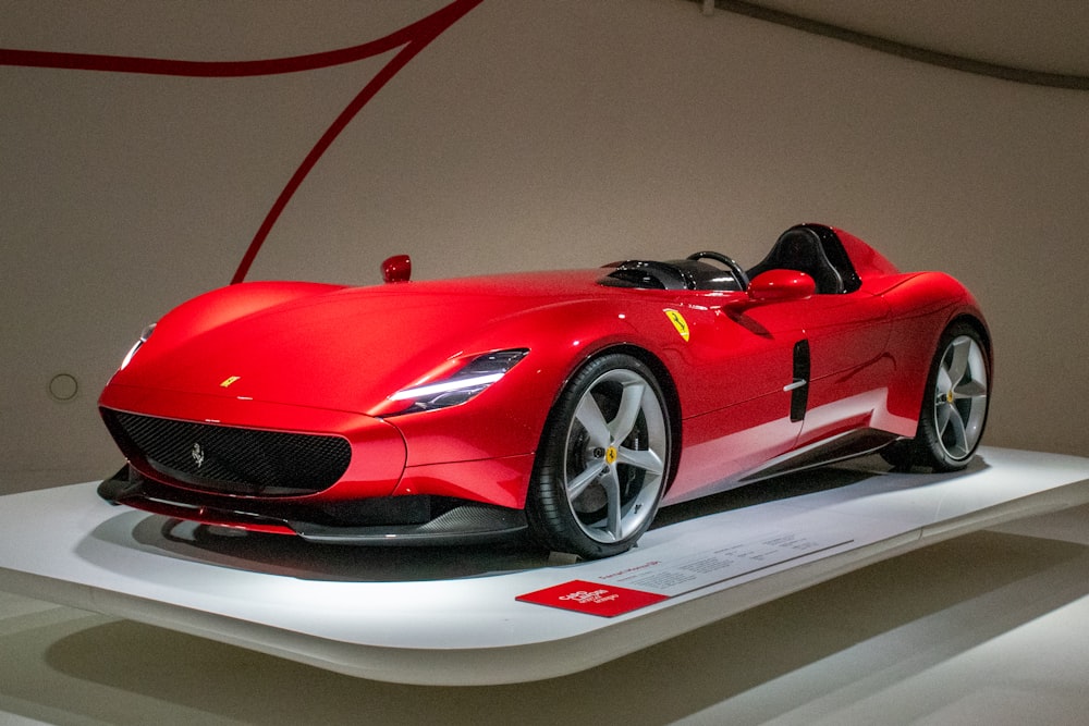 red ferrari 458 italia on white table