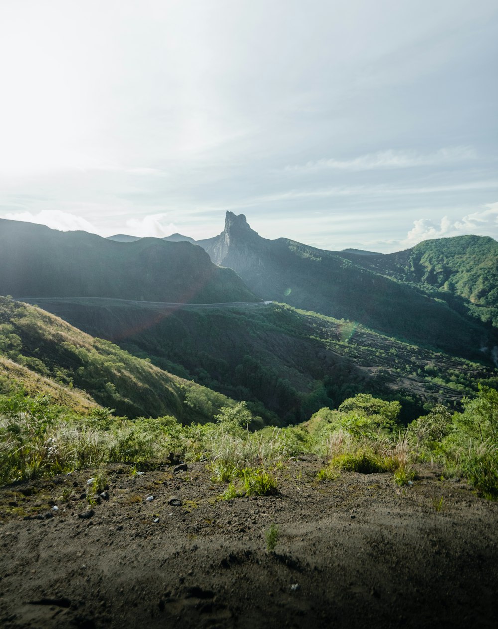 green mountains under white clouds during daytime