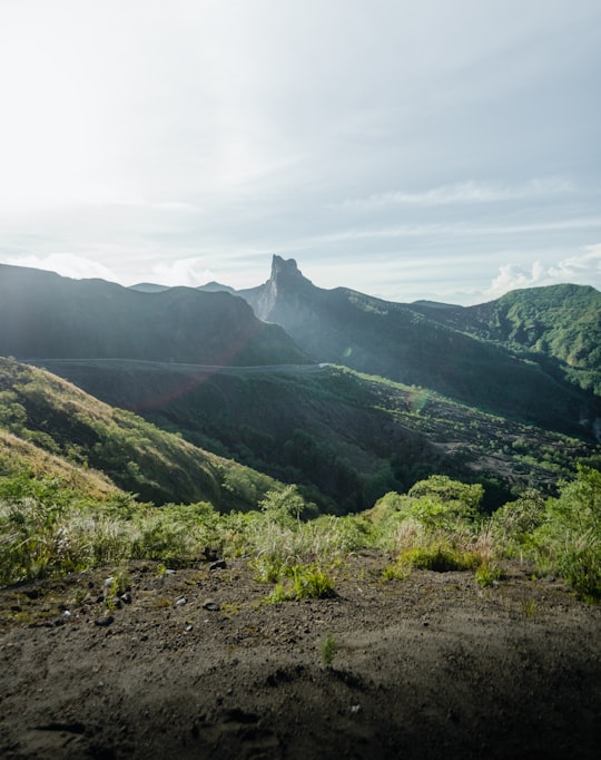 green mountains under white clouds during daytime in Kediri Indonesia