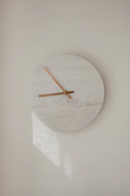 white round analog wall clock