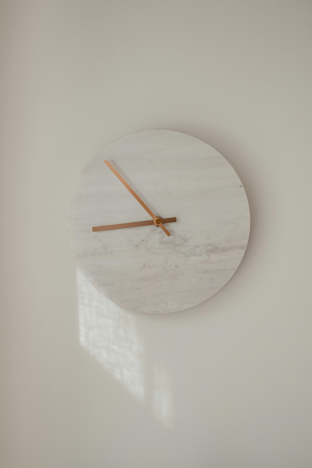 white round analog wall clock