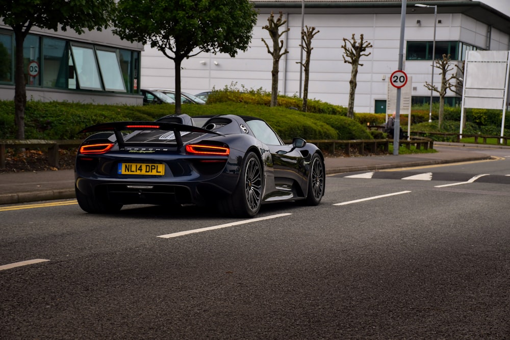 black porsche 911 on road during daytime