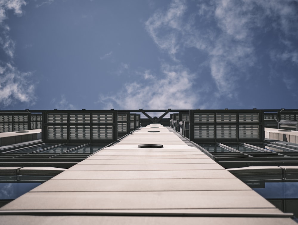 a tall building with a sky in the background