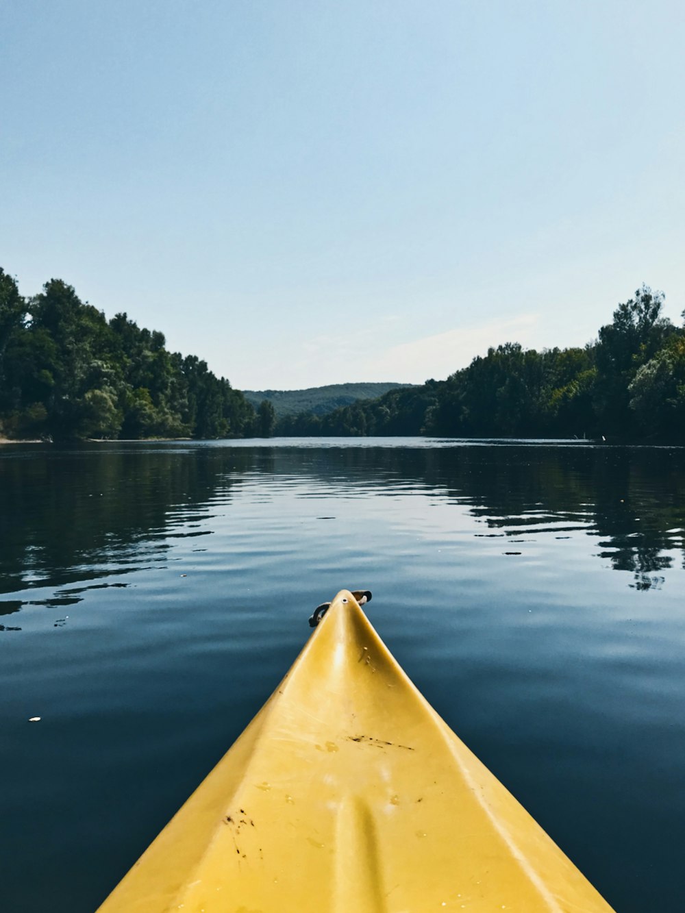 yellow kayak on lake during daytime