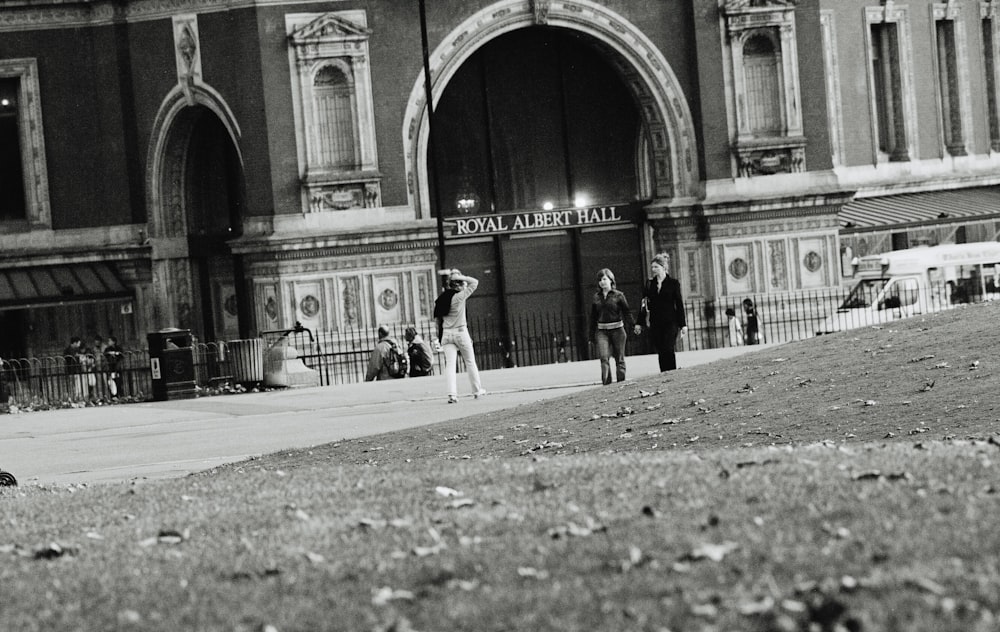 grayscale photo of people walking on street