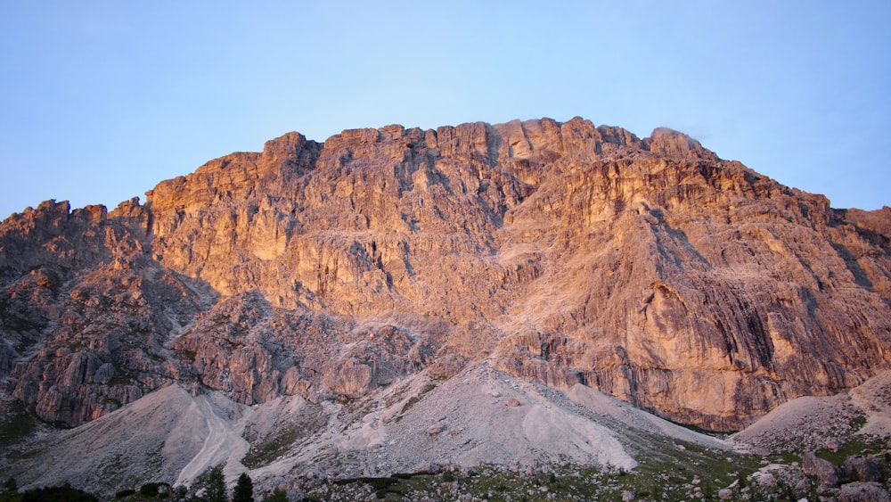 brown rocky mountain under blue sky during daytime