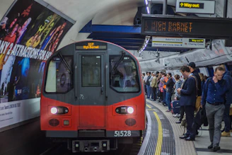 red and black train in the city during daytime