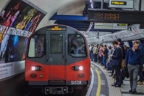 red and black train in the city during daytime