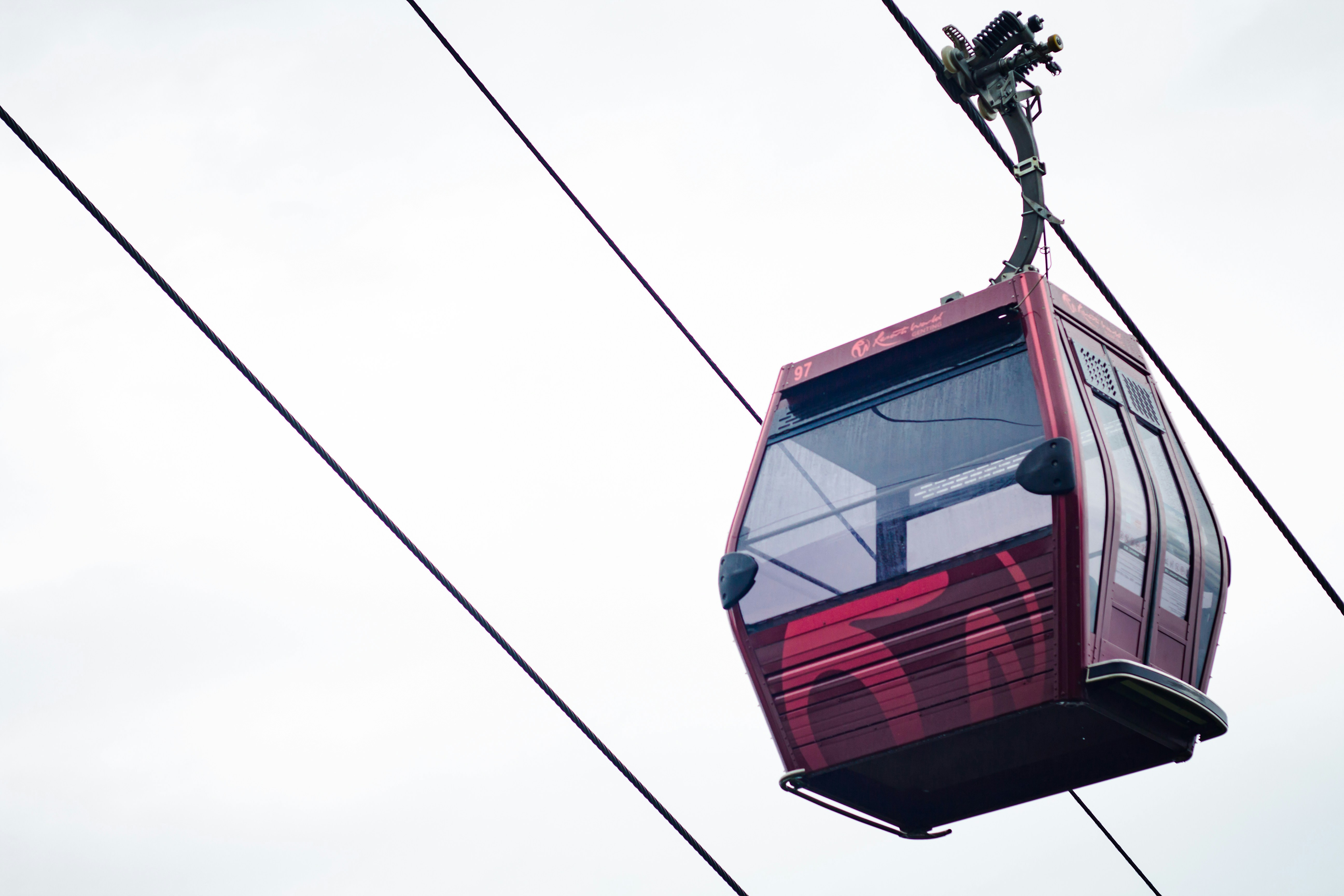 red cable car under white sky during daytime, A cable car at Genting Highlands