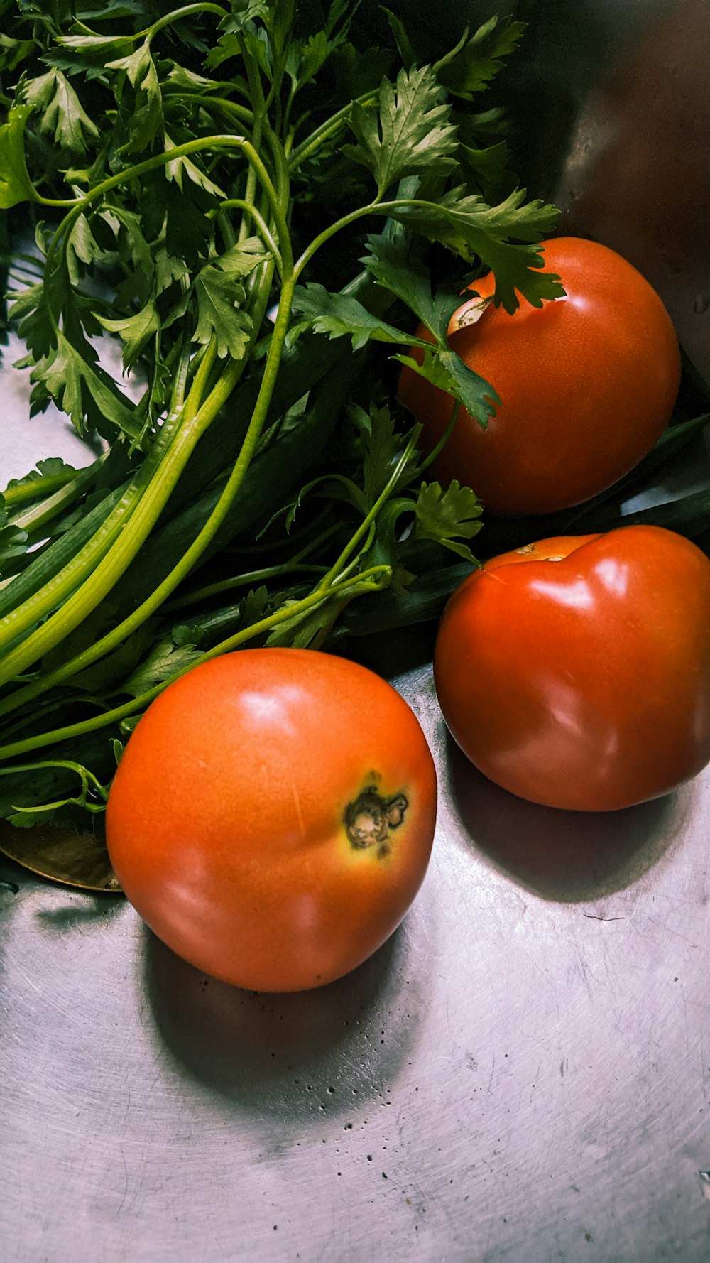 red tomato on white textile