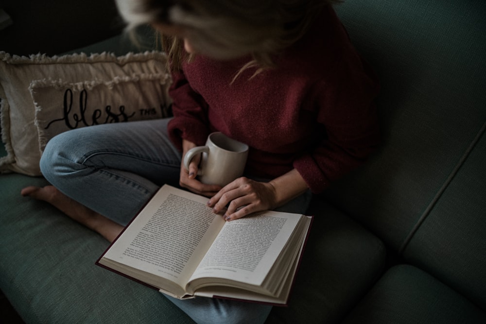 woman in red long sleeve shirt reading book