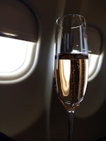 clear wine glass with brown liquid