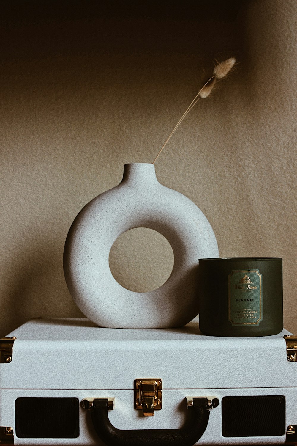 white round ornament on white wooden table