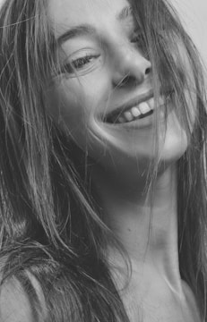 A candid shot of Fred and Leslie with wild hair and silly grins