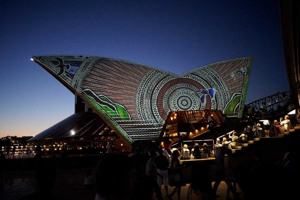 people standing on stadium during night time