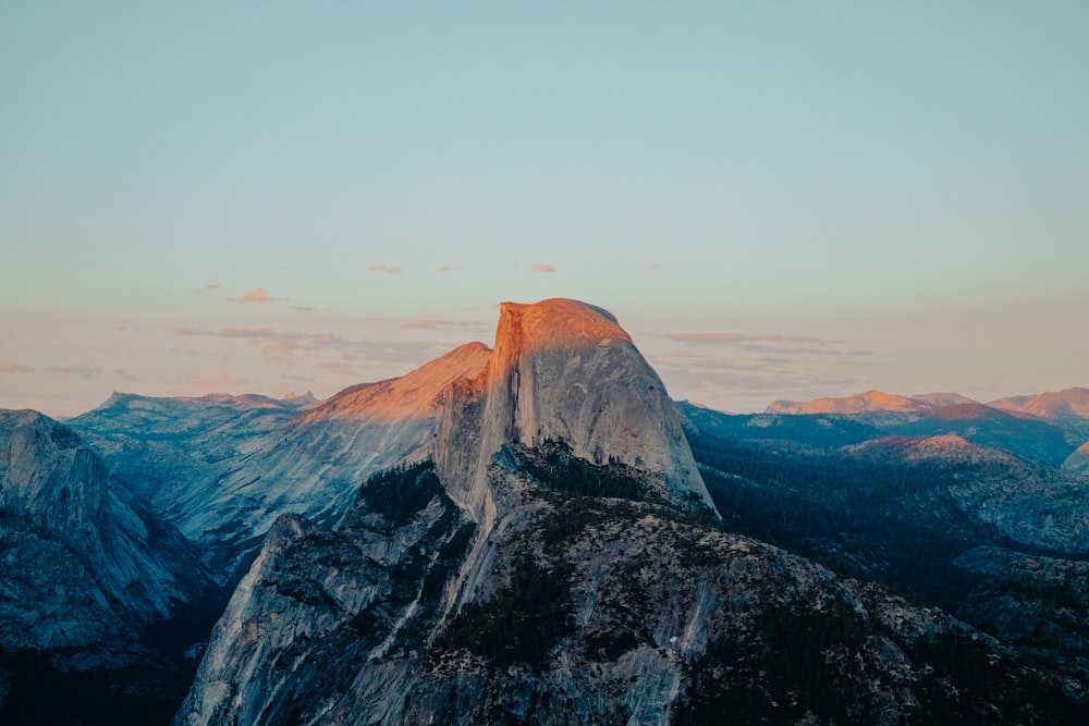 brown rocky mountain under white sky during daytime