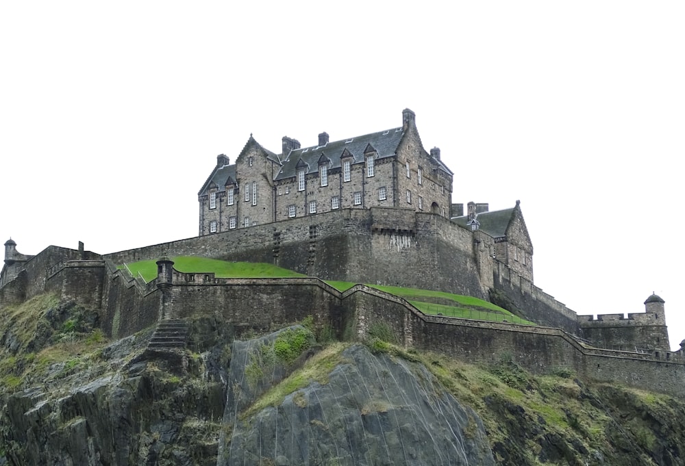 grey concrete castle on top of mountain