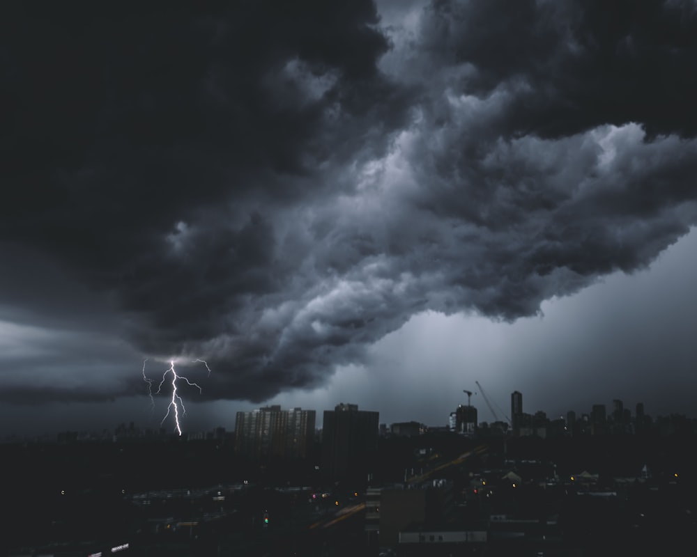 a storm is coming in over a city