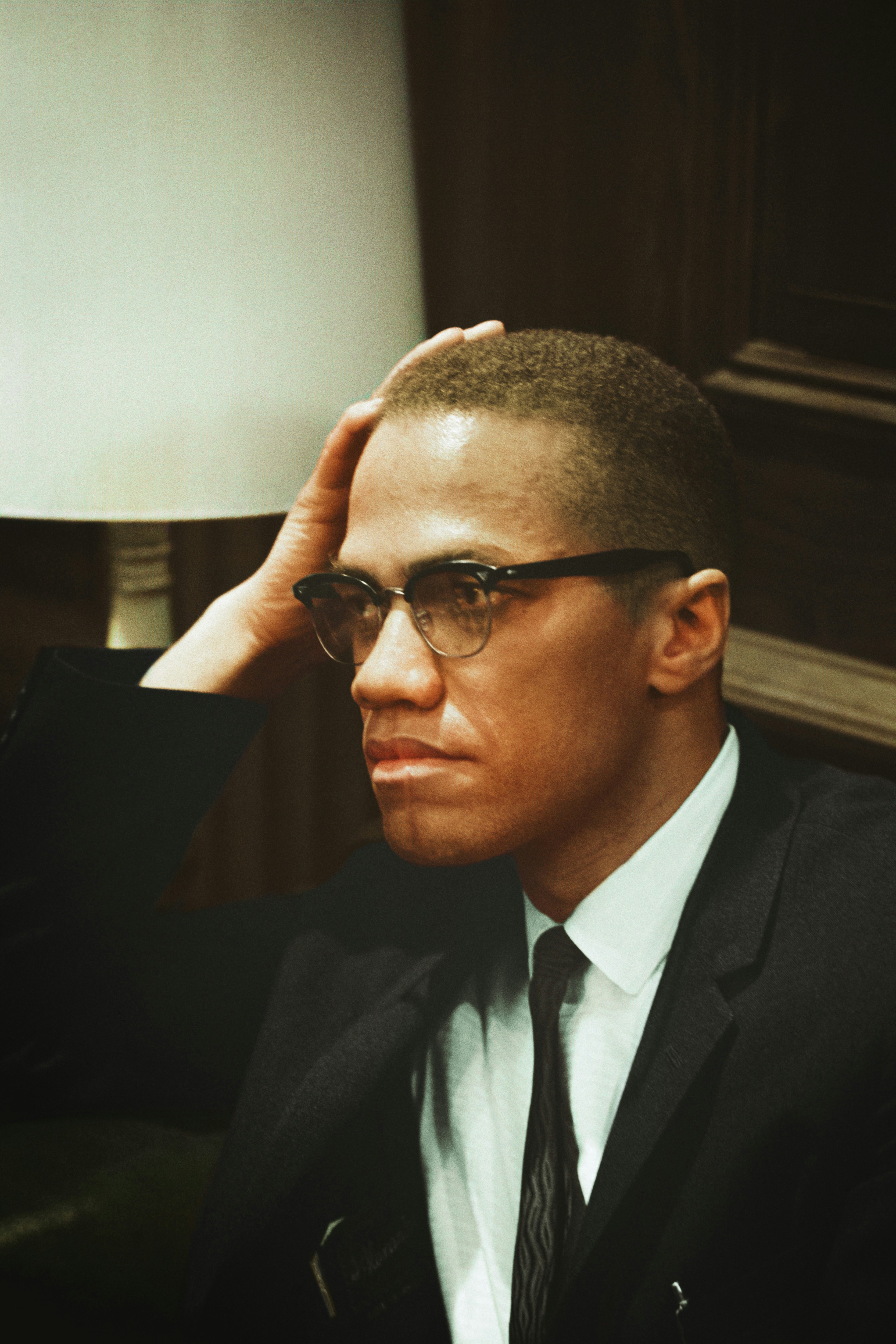 Caption reads, "[Malcolm X waits at Martin Luther King press conference, head-and-shoulders portrait] / [MST]." Original black and white negative by Marion S. Trikosko. Taken March 26th, 1964, Washington D.C, United States (@libraryofcongress). Colorized by Jordan J. Lloyd. Library of Congress Prints and Photographs Division Washington, D.C. 20540 https://www.loc.gov/item/2003688131/