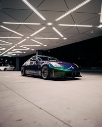 Vibrant specialty paint being applied smoothly on a high-performance vehicle surface.