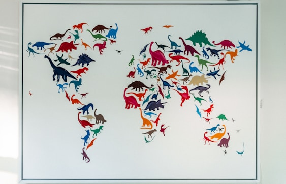 blue and red birds flying under white sky during daytime