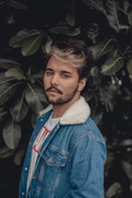 man in blue denim button up jacket