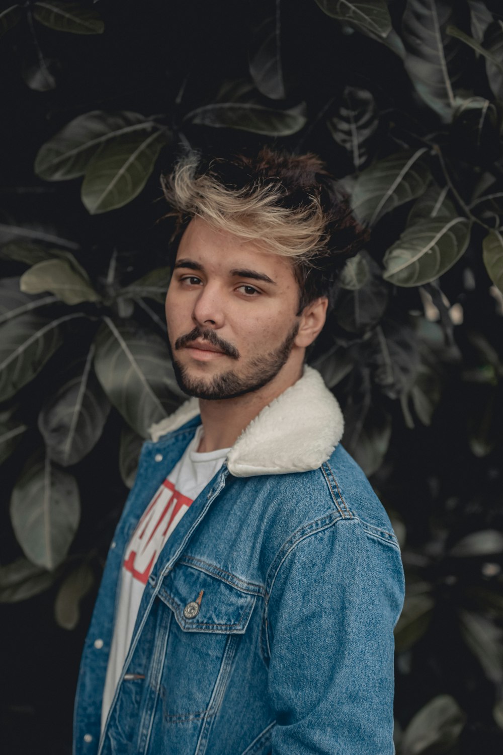 man in blue denim button up jacket