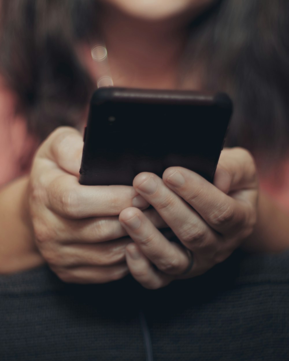 person holding black iphone 4