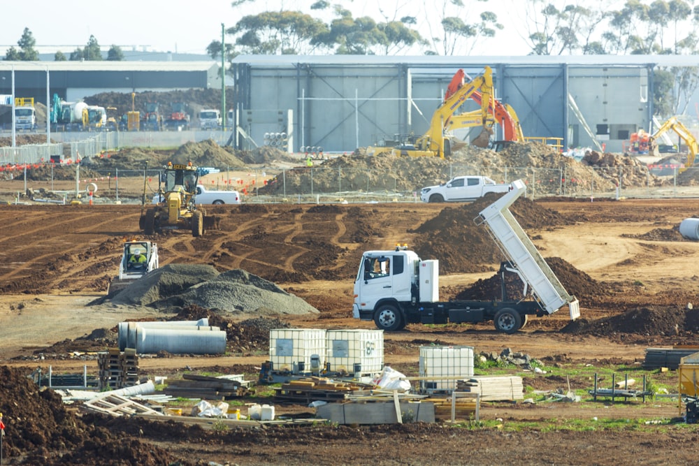 a construction site with trucks and construction equipment