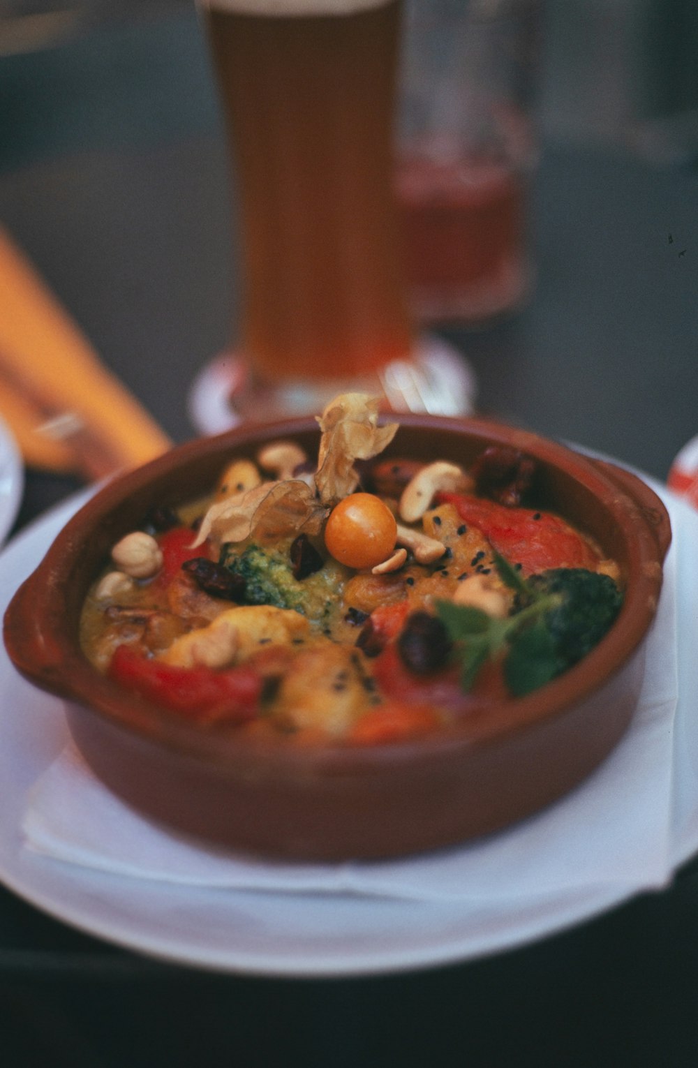 brown ceramic bowl with green vegetable dish