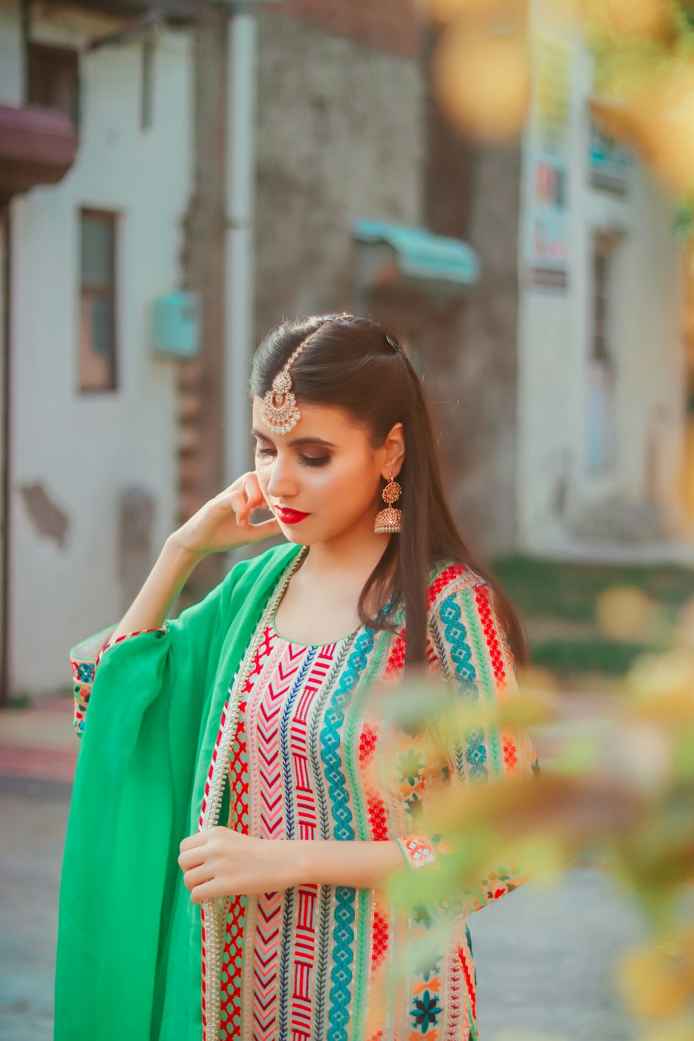 a woman wearing a green shawl and a green shawl