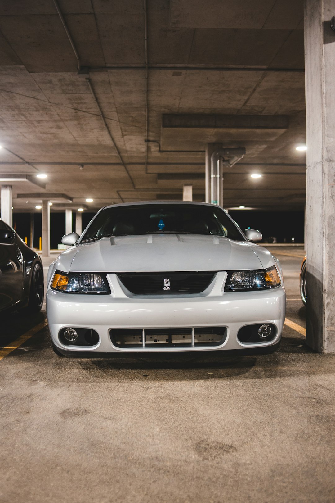 white bmw car parked in garage