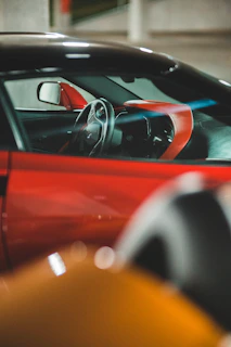 A stylish car interior featuring custom wheels and matching accessories, captured from the driver's seat perspective.